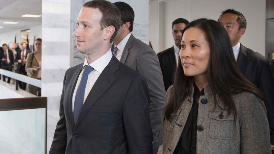 Facebook chief executive Mark Zuckerberg and his executive assistant Andrea Besmehn depart US Senator Bill Nelson’s, D-Florida, office on Capitol Hill in Washington DC on Tuesday.