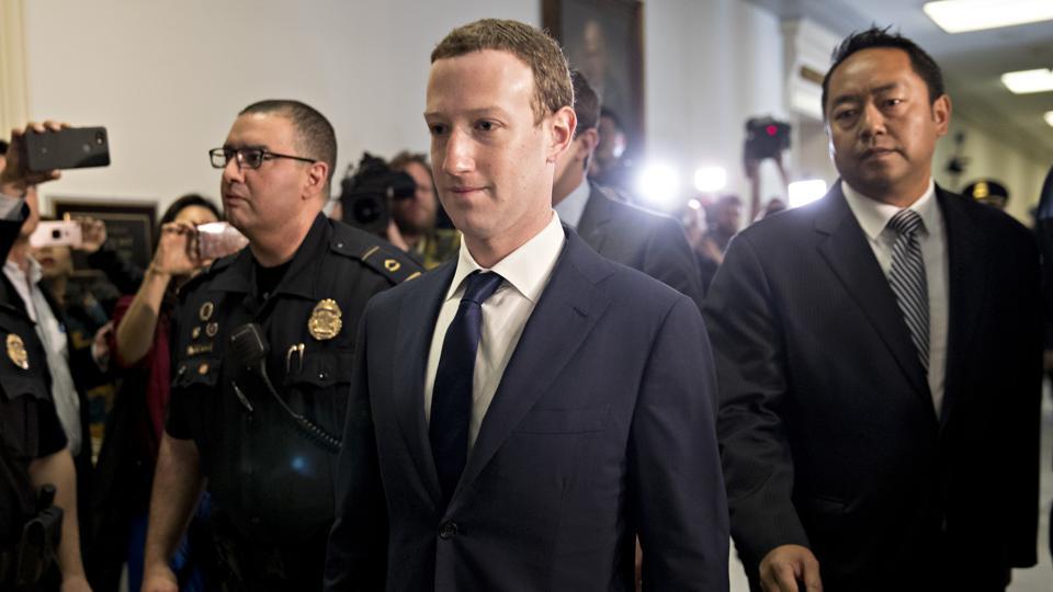 Mark Zuckerberg, chief executive officer and founder of Facebook Inc., walks through the Rayburn House Office building before a House Energy and Commerce Committee hearing in Washington, D.C. on Wednesday.