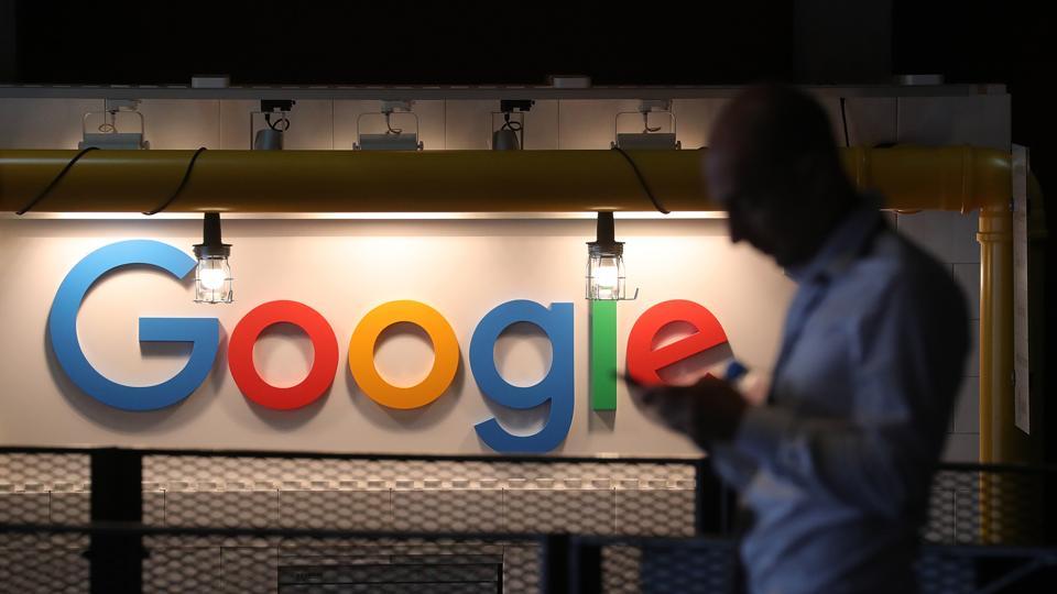 The Google Inc. logo sits illuminated on the company's exhibition stand at the Noah Technology Conference in Berlin, Germany on June 6, 2018.