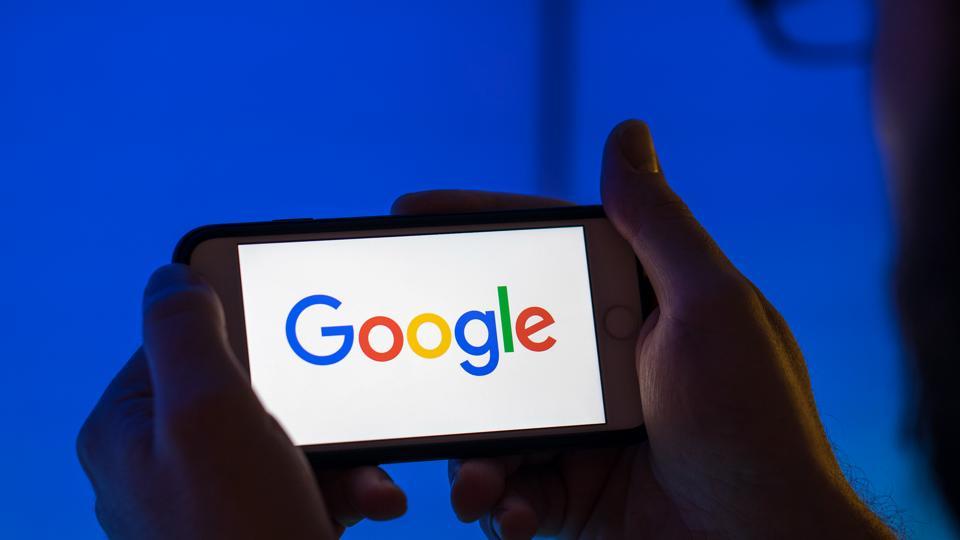 The logo of Google, a unit of Alphabet Inc., sits on an Apple Inc. iPhone smartphone in this arranged photograph in London  on August 20, 2018.