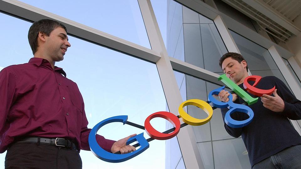 In this Jan. 15, 2004, file photo Google co-founders Larry Page, left, and Sergey Brin pose for a photo at their company's headquarters in Mountain View, California.