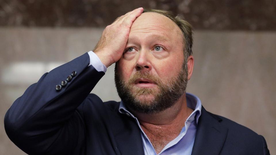 Alex Jones of Infowars talks to the media while visiting the US Senate's Dirksen Senate office building as Twitter CEO Jack Dorsey testifies before a Senate Intelligence Committee hearing on Capitol Hill in Washington.