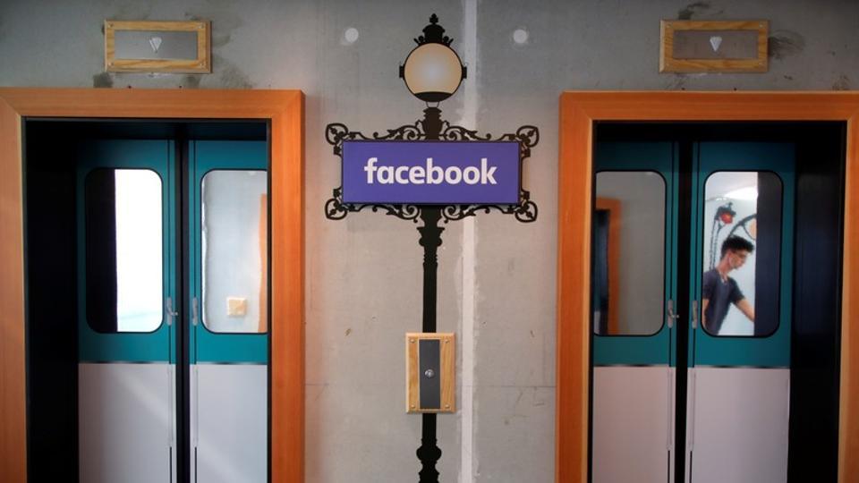 A facsimile metro sign is seen between elevators at the entrance of France's Facebook headquarters in Paris, France, May 15, 2018.