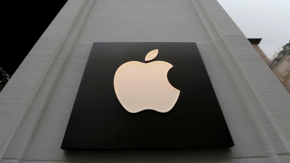 FILE PHOTO: The company's logo is seen outside Austria's first Apple store, which opens on February 24, during a media preview in Vienna, Austria, February 22, 2018.