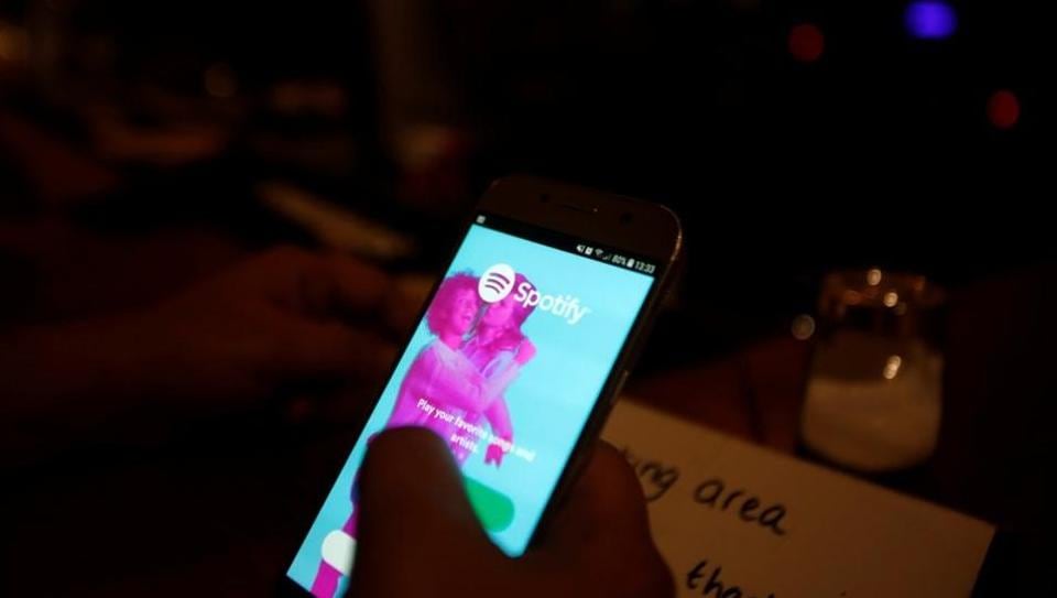 Palestinian musician Firas Harb uses Spotify app on his mobile phone in Beit Sahour, in the occupied West Bank November 20, 2018.