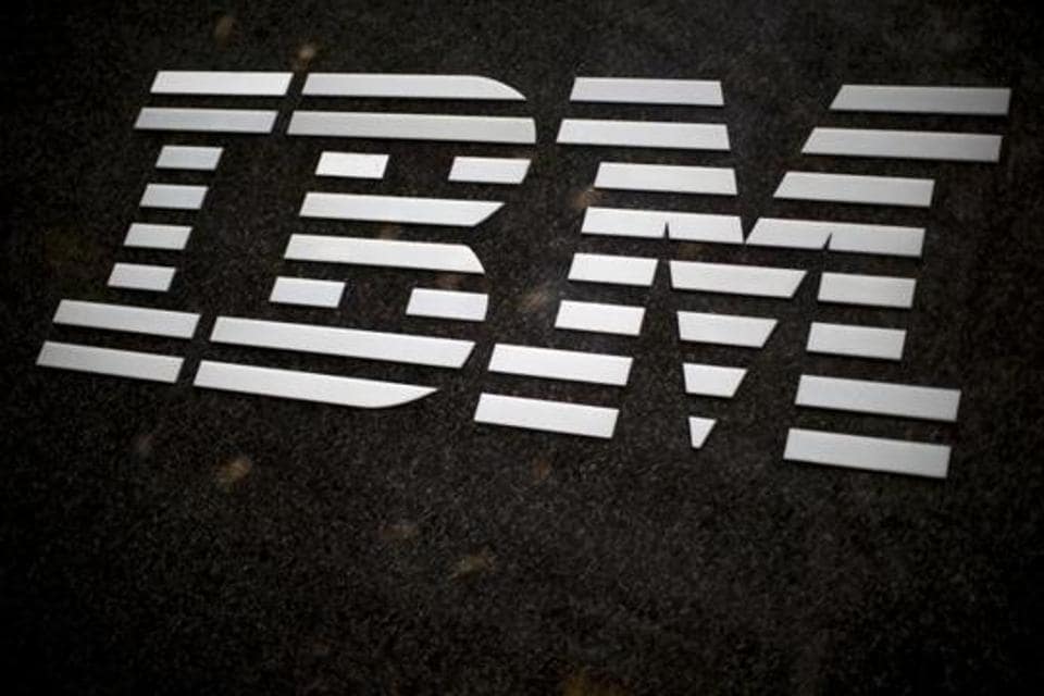 FILE - In this April 26, 2017, file photo, the IBM logo is displayed on the IBM building in Midtown Manhattan, in New York. IBM announced Sunday, Oct. 28, 2018, it will acquire North Carolina-based open-source software company Red Hat in a $34 billion stock deal that the technology and consulting giant's chief executive says will advance the company to the next step in cloud computing.
