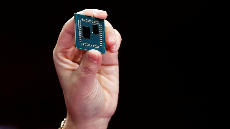 Lisa Su, president and CEO of AMD, holds up a 3rd generation Ryzen desktop processor during a keynote address at the 2019 CES.