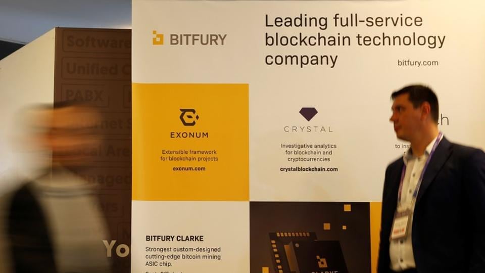 Delegates walk near an exhibition stand of Bitfury, a full-service blockchain technology company, at the Malta Blockchain Summit in St Julian's, Malta November 1, 2018.