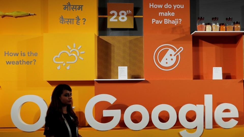 A woman walks past the logo of Google during an event in New Delhi, India, August 28, 2018. REUTERS/Adnan Abidi/Files
