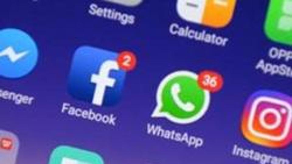 (FILES) This file photo taken on March 22, 2018 shows apps for WhatsApp, Facebook, Instagram and other social networks on a smartphone in Chennai. Indian police urged people on June 27 not to believe false rumours on WhatsApp after five fresh incidents of crazed mobs attacking people left one woman dead and a dozen hurt.