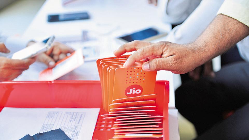 Customers buying Reliance Jio sims at a Reliance Digital centre in Mumbai .