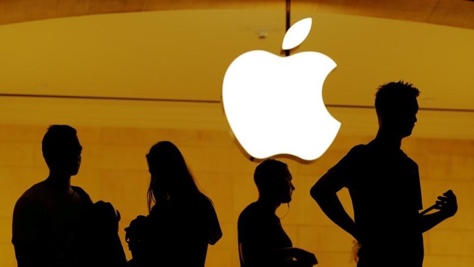 Customers walk past an Apple logo inside of an Apple store at Grand Central Station in New York, U.S., August 1, 2018.