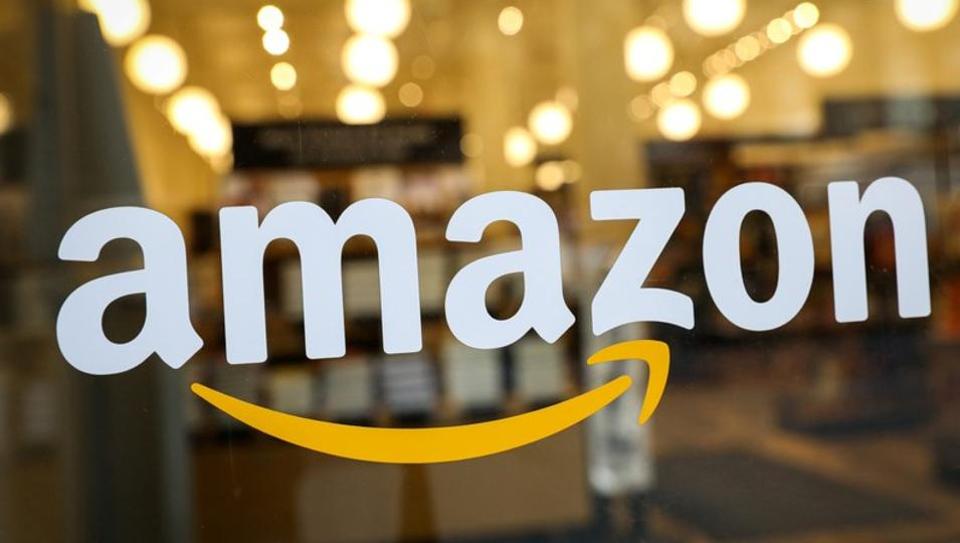 The logo of Amazon is seen on the door of an Amazon Books retail store in New York City, U.S., February 14, 2019.