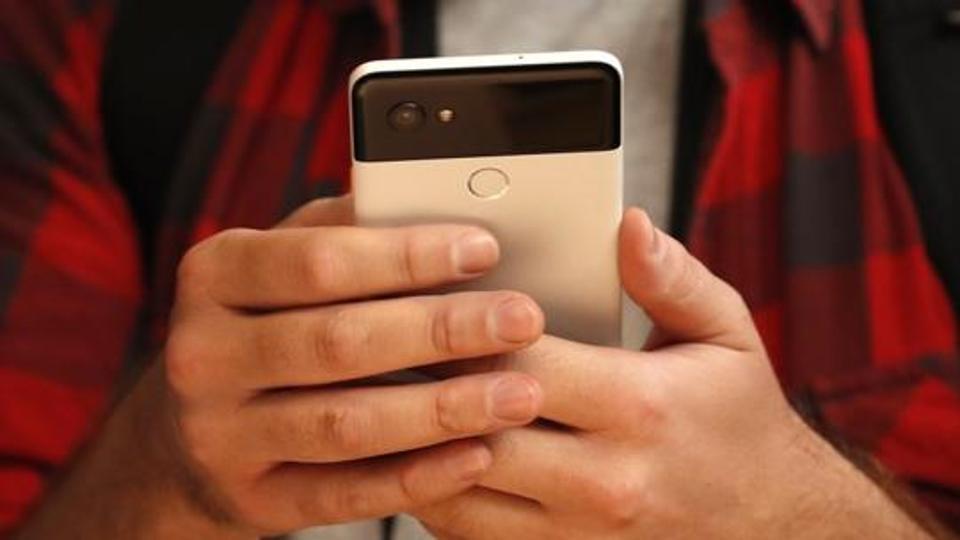 People try out Google's Pixel 2 phones during a launch event in San Francisco, California, U.S. October 4, 2017. REUTERS/Stephen Lam