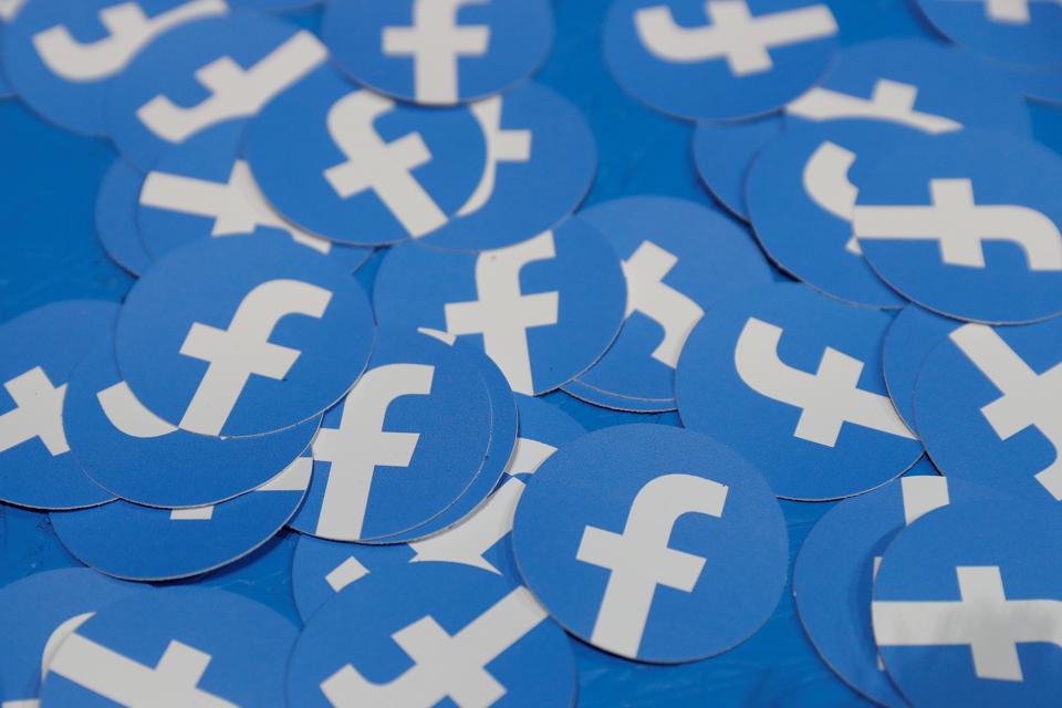 FILE PHOTO: Stickers bearing the Facebook logo are pictured at Facebook Inc's F8 developers conference in San Jose, California, U.S., April 30, 2019. REUTERS/Stephen Lam/File Photo