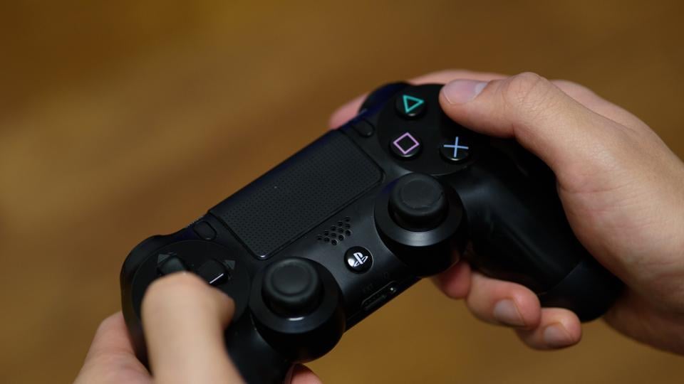 Sony reported weaker profits in the PlayStation business and cut its annual revenue forecast, triggering the steepest share decline in almost three and a half years.