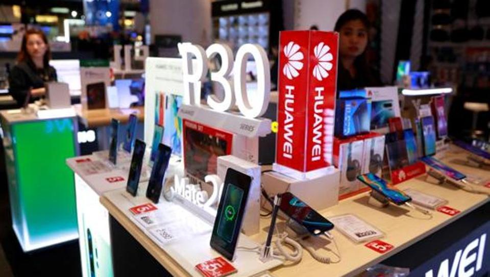 An employee sells Huawei P30 handset in a shopping centre in Bangkok, Thailand May 22, 2019.