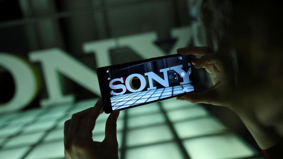 FILE PHOTO: An employee takes a photo on a new Sony Xperia 10 Plus in this posed photograph at a pre-launch event at the Sony offices in London, Britain February 14, 2019.