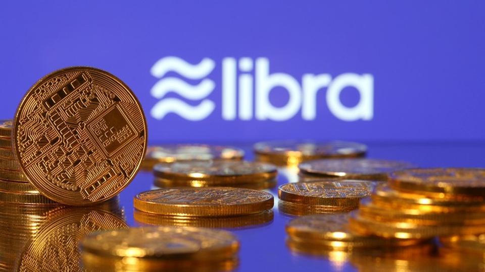 Representations of virtual currency are displayed in front of the Libra logo in this illustration picture, June 21, 2019.