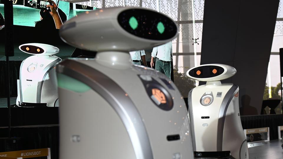 This picture taken on July 17, 2019 shows autonomous cleaning robots moving on a platform during a launch in Singapore.