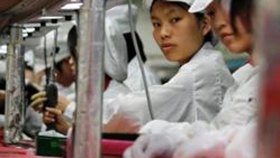 Workers are seen inside a Foxconn factory. Coronavirus outbreak in China’s Hubei province has forced Foxconn to keep its factories shut until February 10, at least.