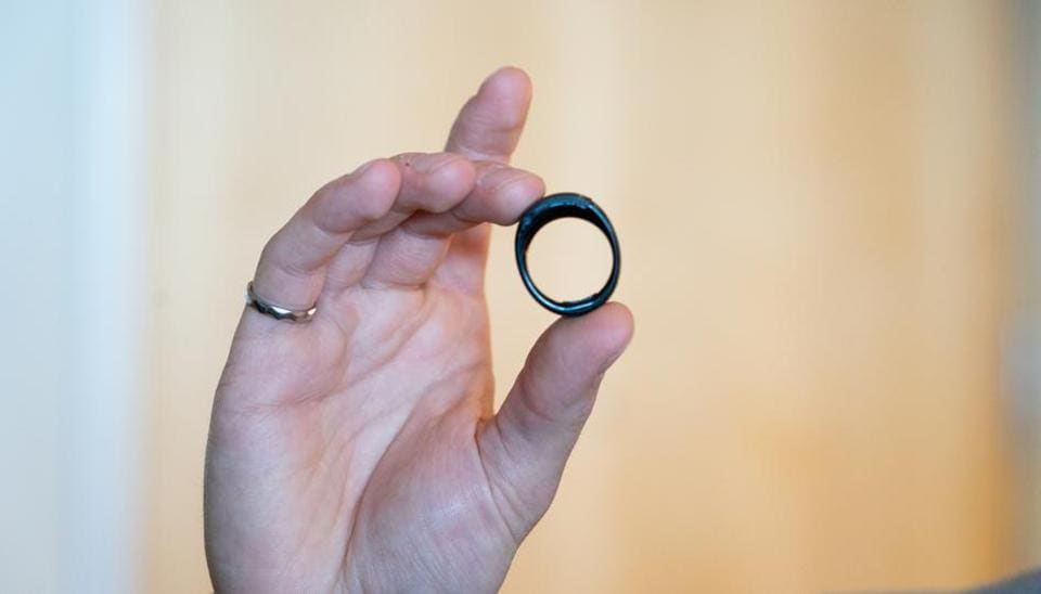 A worker holds an Amazon.com Inc. Echo Loop smart ring during an unveiling event at the company's headquarters in Seattle, Washington, U.S., on Wednesday, Sept. 25, 2019.