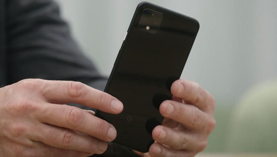 In this Tuesday, Sept. 24, 2019, photo Rick Osterloh, SVP of Google Hardware holds a new Pixel 4 phone while interviewed in Mountain View, Calif.
