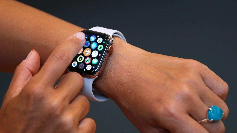 A customer checks Apple's new Apple Watch Series 4 after it went on sale at the Apple Store in Tokyo's Omotesando shopping district, Japan, September 21, 2018.