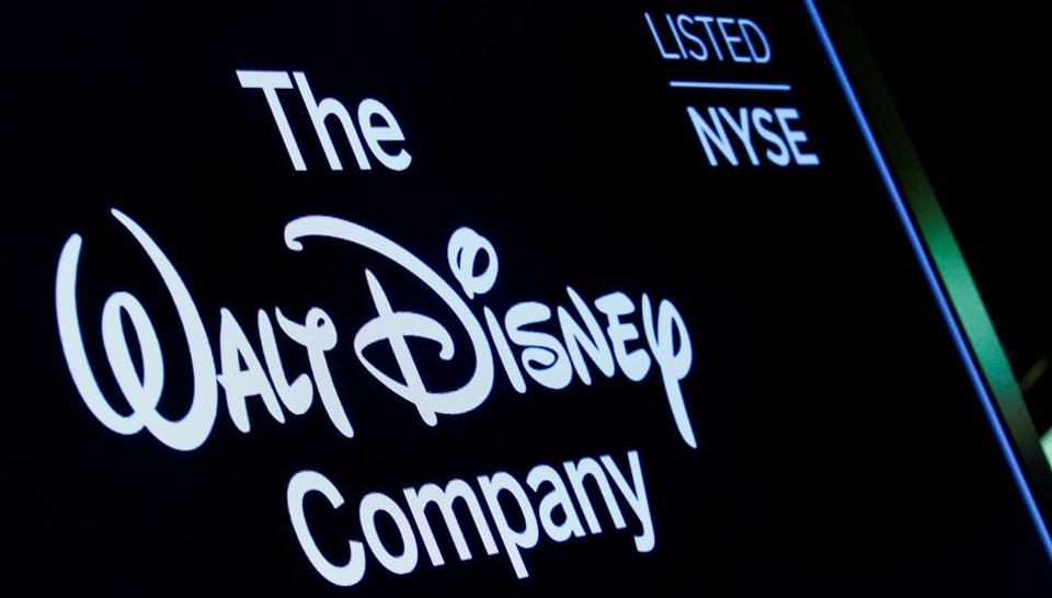 FILE PHOTO: A screen shows the logo and a ticker symbol for The Walt Disney Company on the floor of the New York Stock Exchange (NYSE) in New York, U.S., December 14, 2017.