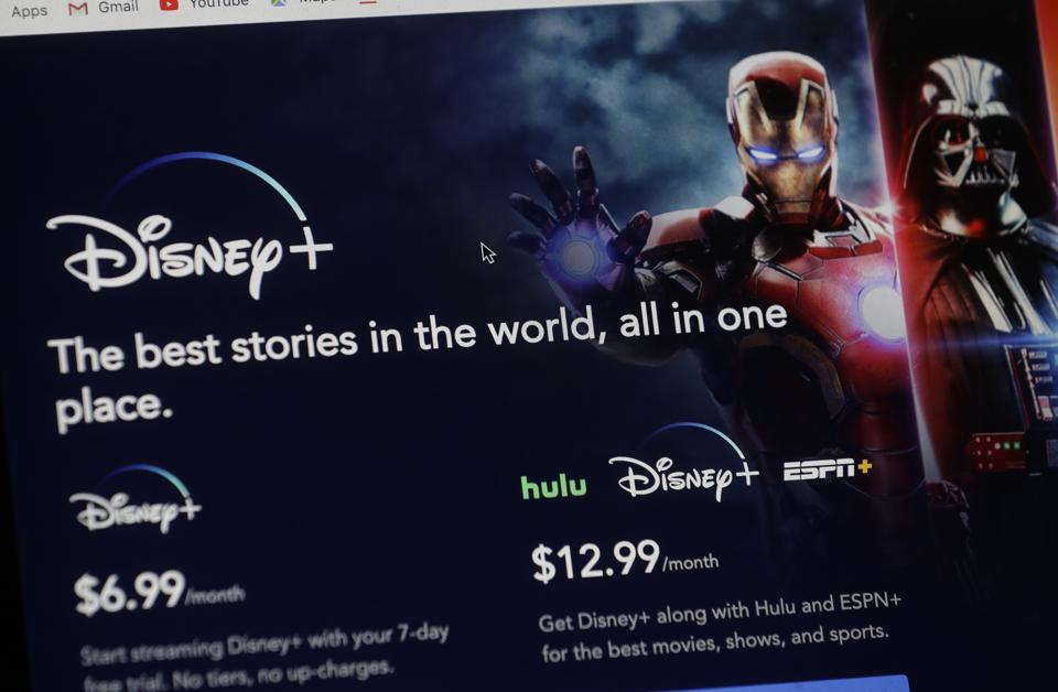 An introductory page on the Disney Plus website is displayed on a computer screen in Walpole, Mass., Wednesday, Nov. 13, 2019. Disney Plus says it hit more than 10 million sign-ups on its first day of launch, far exceeding expectations.