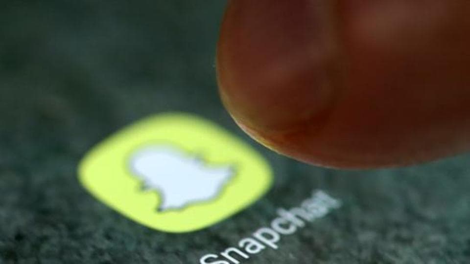 FILE PHOTO: The Snapchat app logo is seen on a smartphone in this picture illustration taken September 15, 2017. REUTERS/Dado Ruvic/Illustration
