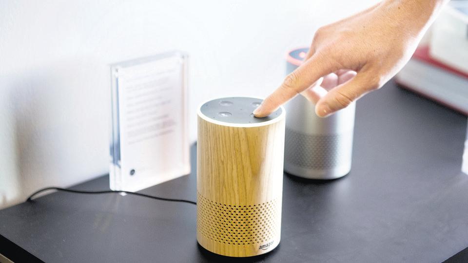 An attendee operates the new Amazon.com Inc. Echo device on display during the company's product reveal launch event in downtown Seattle, Washington, U.S., on Wednesday, Sept. 27, 2017. Amazon unveiled a smaller, cheaper version of its popular Alexa-powered Echo speaker that the e-commerce giant said has better sound. Photographer: Daniel Berman/Bloomberg