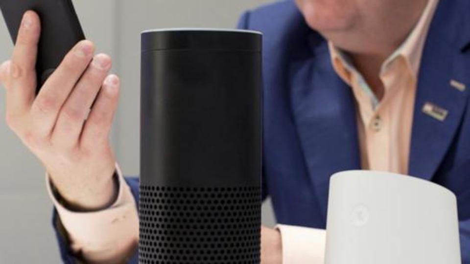 In this June 14, 2018, photo, an Amazon Echo, center, and a Google Home, right, are displayed in New York. Google contractors are listening to some recordings of people talking to Assistant, either on their phone or through smart speakers such as the Google Home. The company says some of its Dutch language recordings were leaked and that it is investigating.