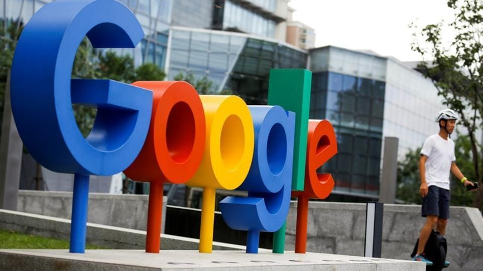 FILE PHOTO: The brand logo of Alphabet Inc's Google is seen outside its office in Beijing, China, August 8, 2018. REUTERS/Thomas Peter/File Photo