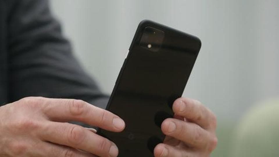 In this Tuesday, Sept. 24, 2019, photo Rick Osterloh, SVP of Google Hardware holds a new Pixel 4 phone while interviewed in Mountain View, Calif. (AP Photo/Jeff Chiu)