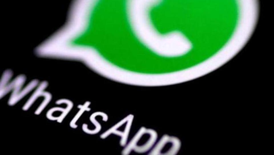 The WhatsApp messaging application is seen on a phone screen