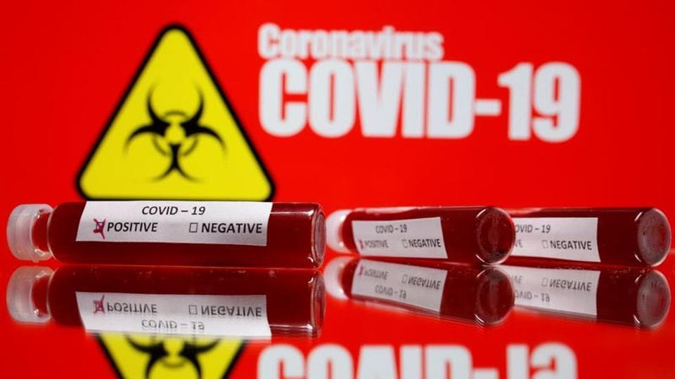 Fake blood is seen in test tubes labelled with the coronavirus (COVID-19) in this illustration taken March 11, 2020.