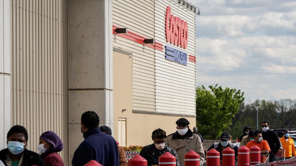 People wear masks as they wait to enter a Costco Wholesale store during the outbreak of coronavirus disease (COVID-19) in Washington, DC, U.S. April 10, 2020.