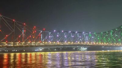 Howrah Bridge illuminated in Tri-color ahead of Independence Day 2023, in Kolkata on Monday. (ANI Photo)
