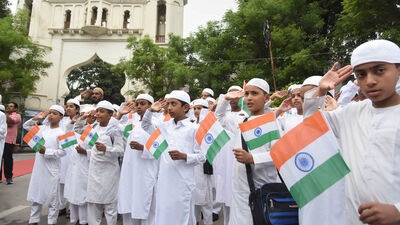 Students of Madrasa Alhamoomi Litahfeez AlQuraan celebrate the 77th Independence Day at Shahi Masjid public garden, in Hyderabad. (PTI Photo)