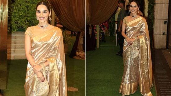 బంగారు పట్టుచీరలో మానుషి చిల్లర్ రాయల్ గా కనిపించింది. చోకర్ నెక్లెస్, పొట్లీ బ్యాగ్ తో ఆమె దీన్ని డిజైన్ చేసింది. బంగారు పట్టుచీరలో మానుషి చిల్లర్ రాయల్ గా కనిపించింది. చోకర్ నెక్లెస్, పొట్లీ బ్యాగ్ తో ఆమె దీన్ని డిజైన్ చేసింది. 