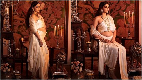 తన ప్రెగ్నెన్సీ ఫోటోషూట్ కోసం సోనమ్ అబూ జానీ సందీప్ ఖోస్లా డిజైన్ చేసిన రీగల్ డ్రెస్ లో తన బేబీ బంప్ ను ప్రదర్శించింది. నటి ఏనుగు దంతాల చీరను ధరించింది, దాని దుప్పటిని ఆమె శరీరం చుట్టూ రొమాంటిక్ గా చుట్టారు. పల్లును సున్నితంగా ఒక భుజం మీద ఉంచి స్టైలిష్ స్ట్రాప్ లెస్ బ్లౌజ్ ని చూపిస్తూ ఉంటుంది. &nbsp;