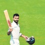 Virat-Kohli-gestures-as-he-walks-back-after-scorin