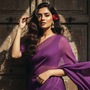 <p>Create a retro, vintage-inspired image—grainy yet bright—based on the uploaded picture. The girl should be draped in a perfect purple chiffon, Pinterest-style aesthetic saree. The vibe must capture the essence of a '90s movie 'baddie,' with dark brown, silky hair and a small flower tucked visibly into her hair, enhanced by a windy, romantic atmosphere. She is standing against an old wooden door, where deep shadows and dramatic contrasts add mystery and artistry to the scene, creating a moody yet enchanting cinematic effect. Her pose should suggest that she is adjusting her hair.</p>